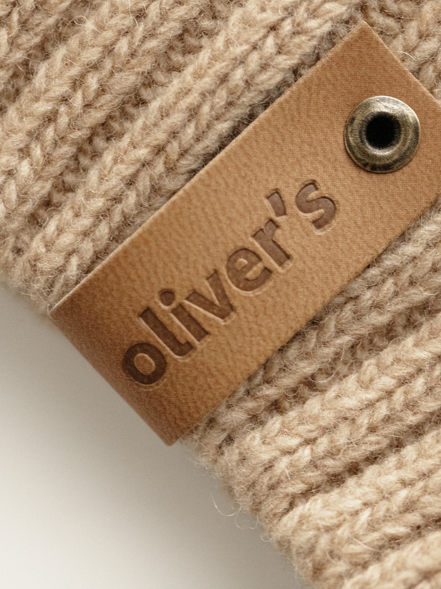 Oliver's soft beige merino sweater dog close up